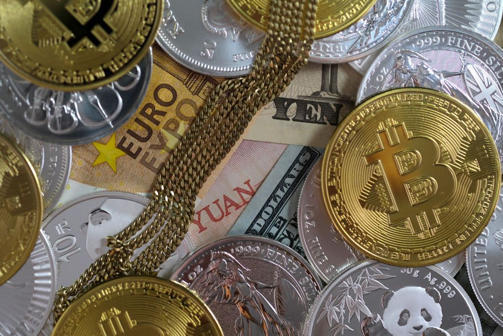 'Debasement Trade' Resurfaces as Bessent's Bond Buyback Move Lifts Gold, Bitcoin